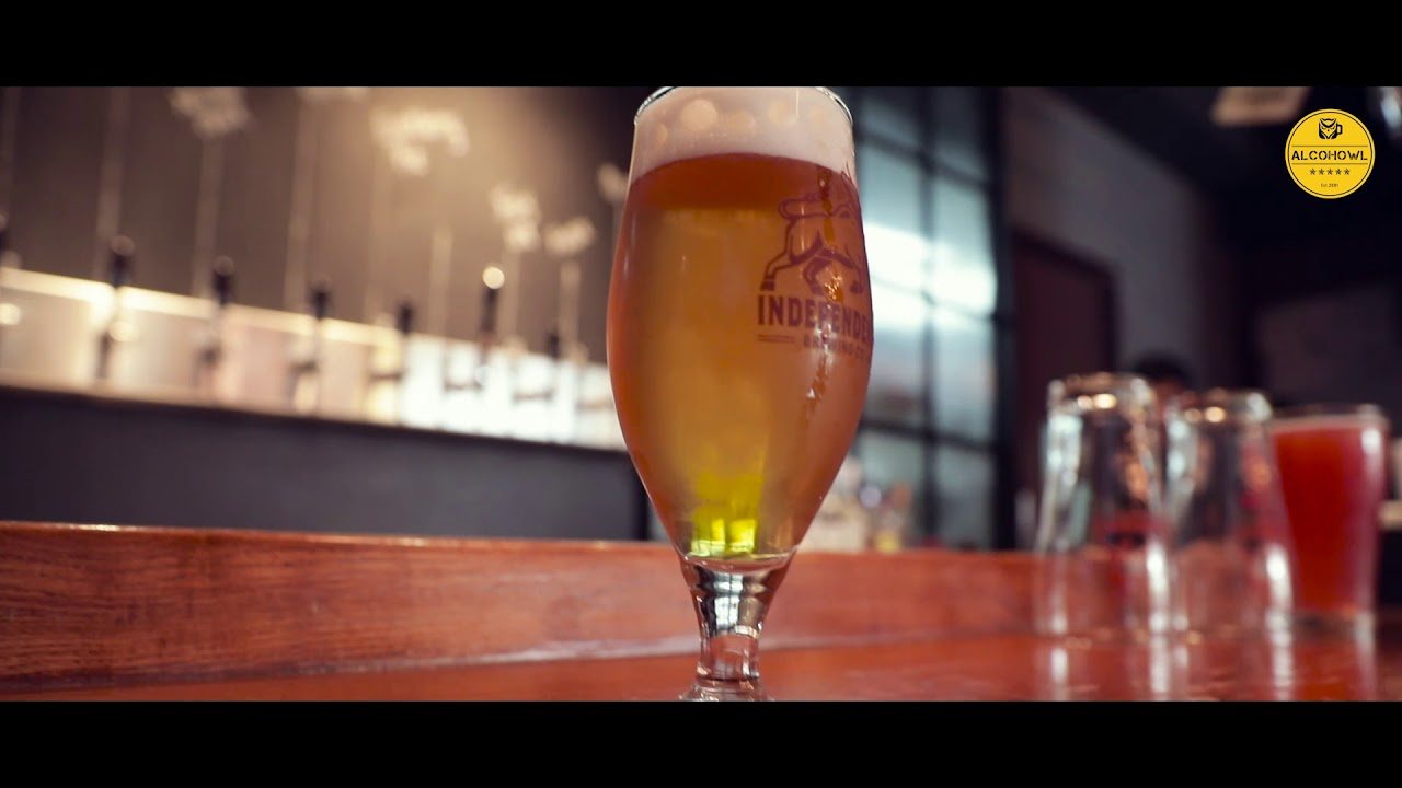 A glass of Independence craft beer on the bar
